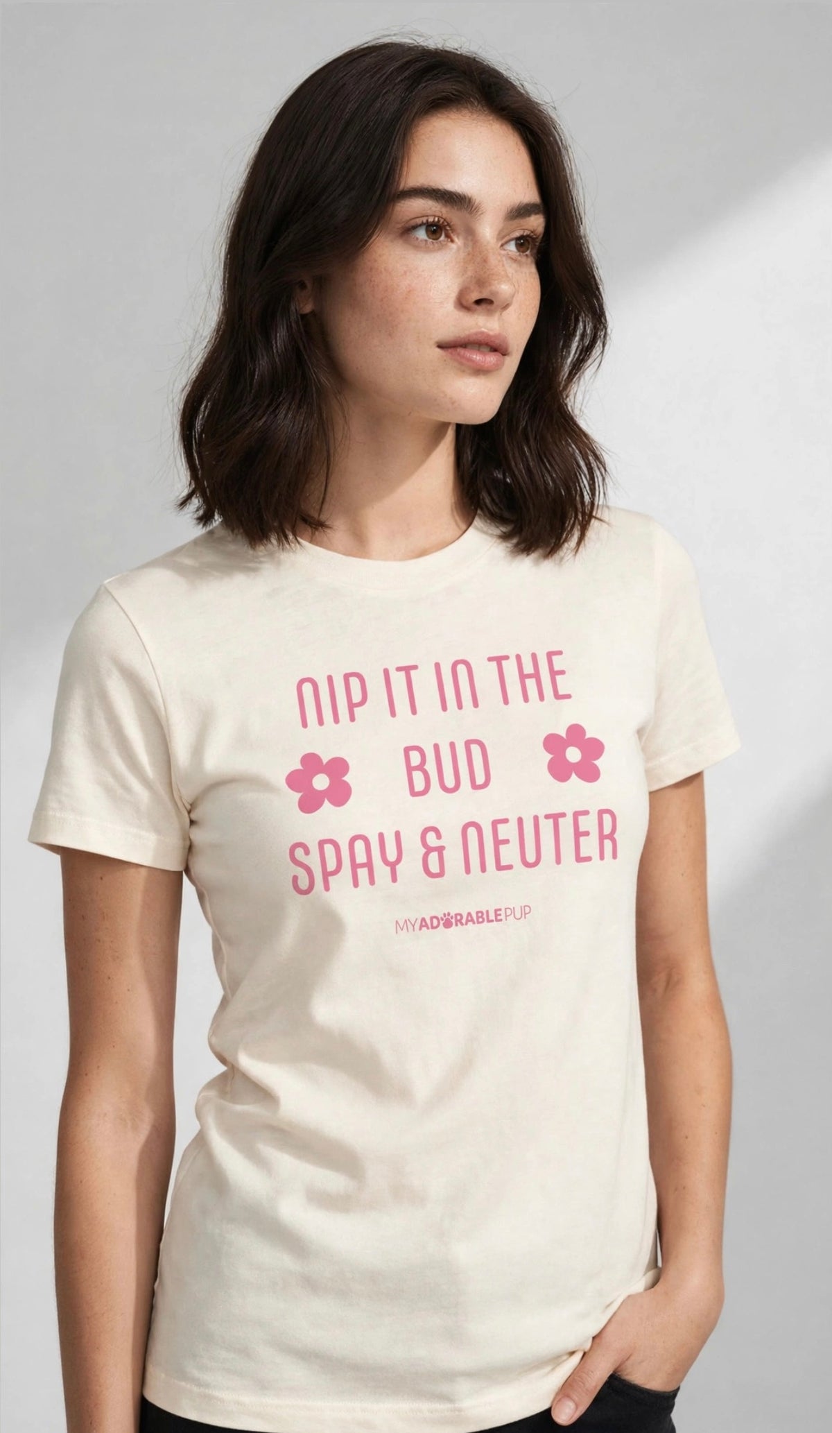 Cream unisex T-shirt with pink graphic 'Nip It in the Bud' and 'Spay & Neuter'