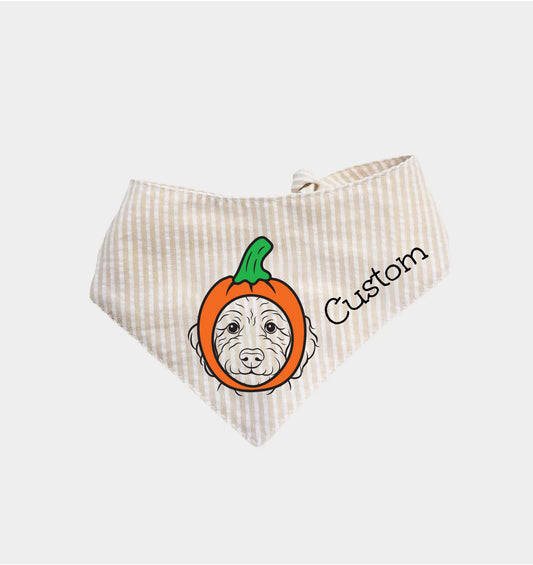 Beige striped dog bandana with pumpkin face graphic and custom text